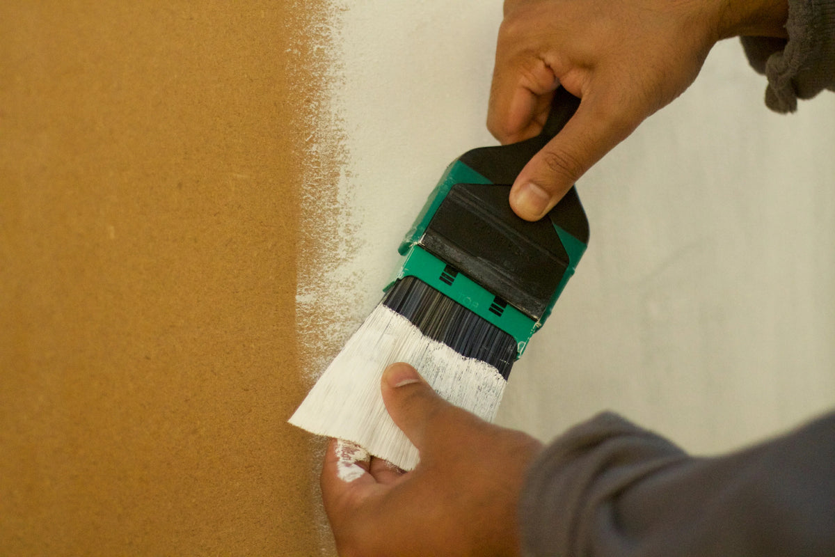 hands inserting brush refill into handle