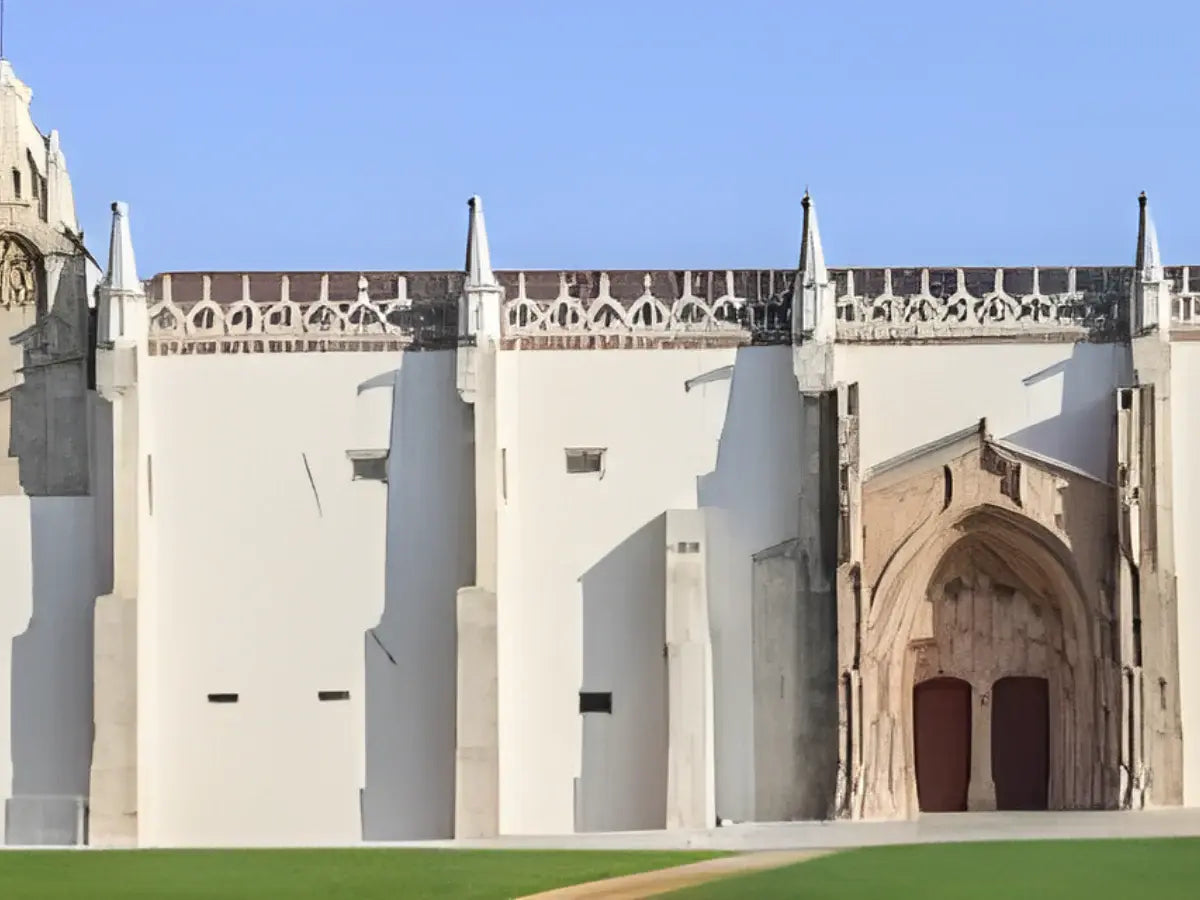 Large stone building with architectural details under a clear blue sky