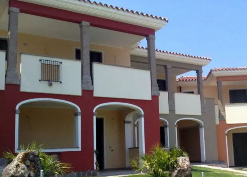 Buildings finished with Plaster Paint in red and white