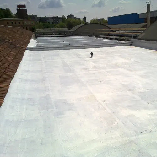 a flat roof with trees behind