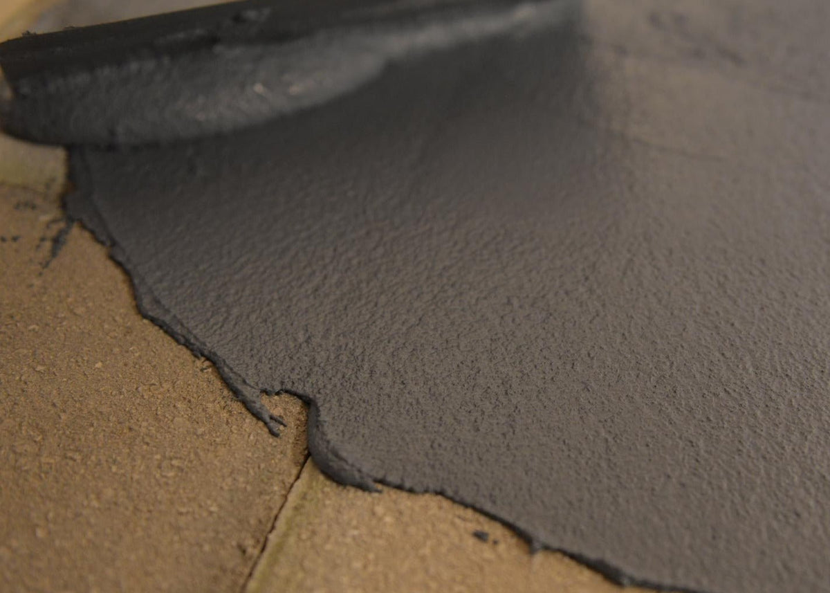 acriflex rapido being applied to brick surface with a trowel