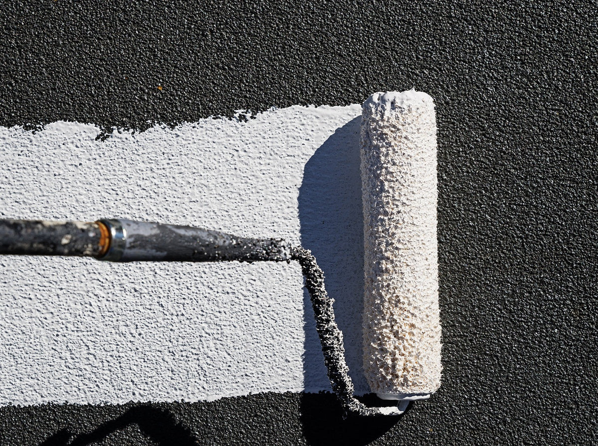paint roller applying acriflex to surface