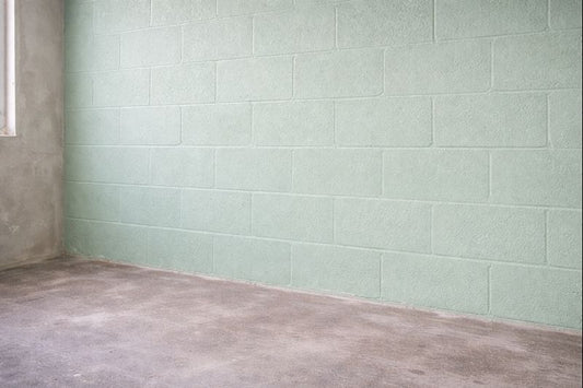 Block walls primed with Aquabond, green textured coat ready for plaster