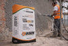 Diathonite Thermactive.037 15 kg bag, spray application on a brick wall behind